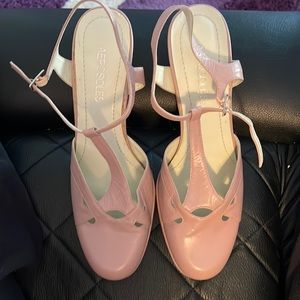 Woman’s pale pink heels